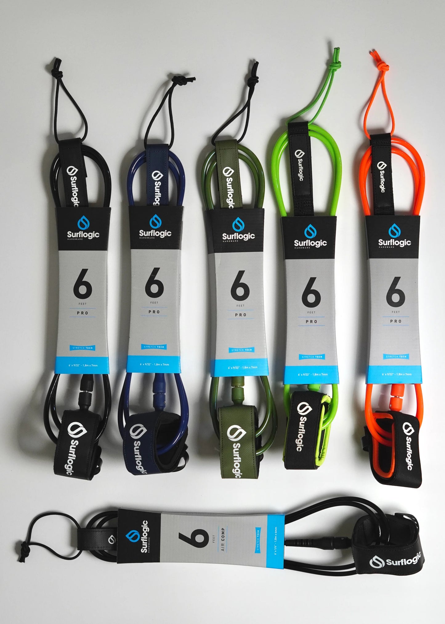 Five coloured Surflogic Leash Pro 6' leashes beside a black Air Comp leash