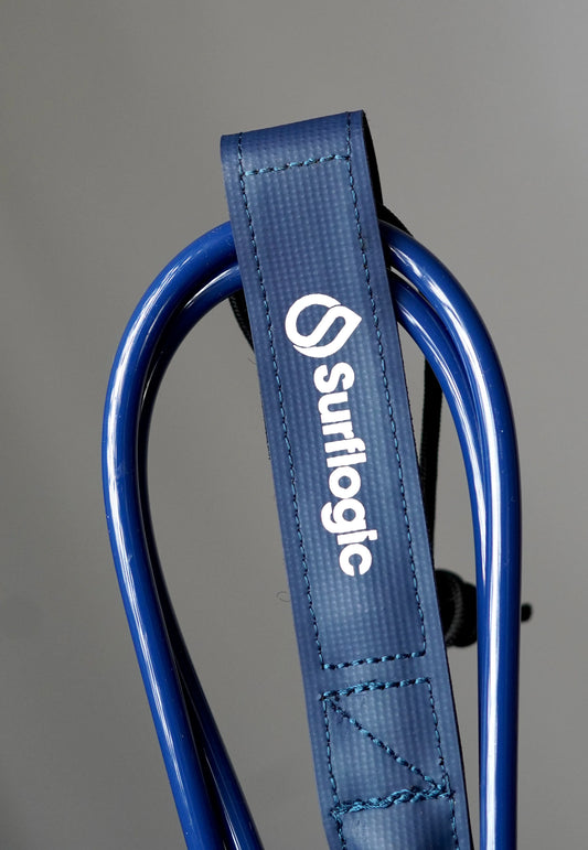 Close-up of the navy Surflogic leash with coiled blue cord