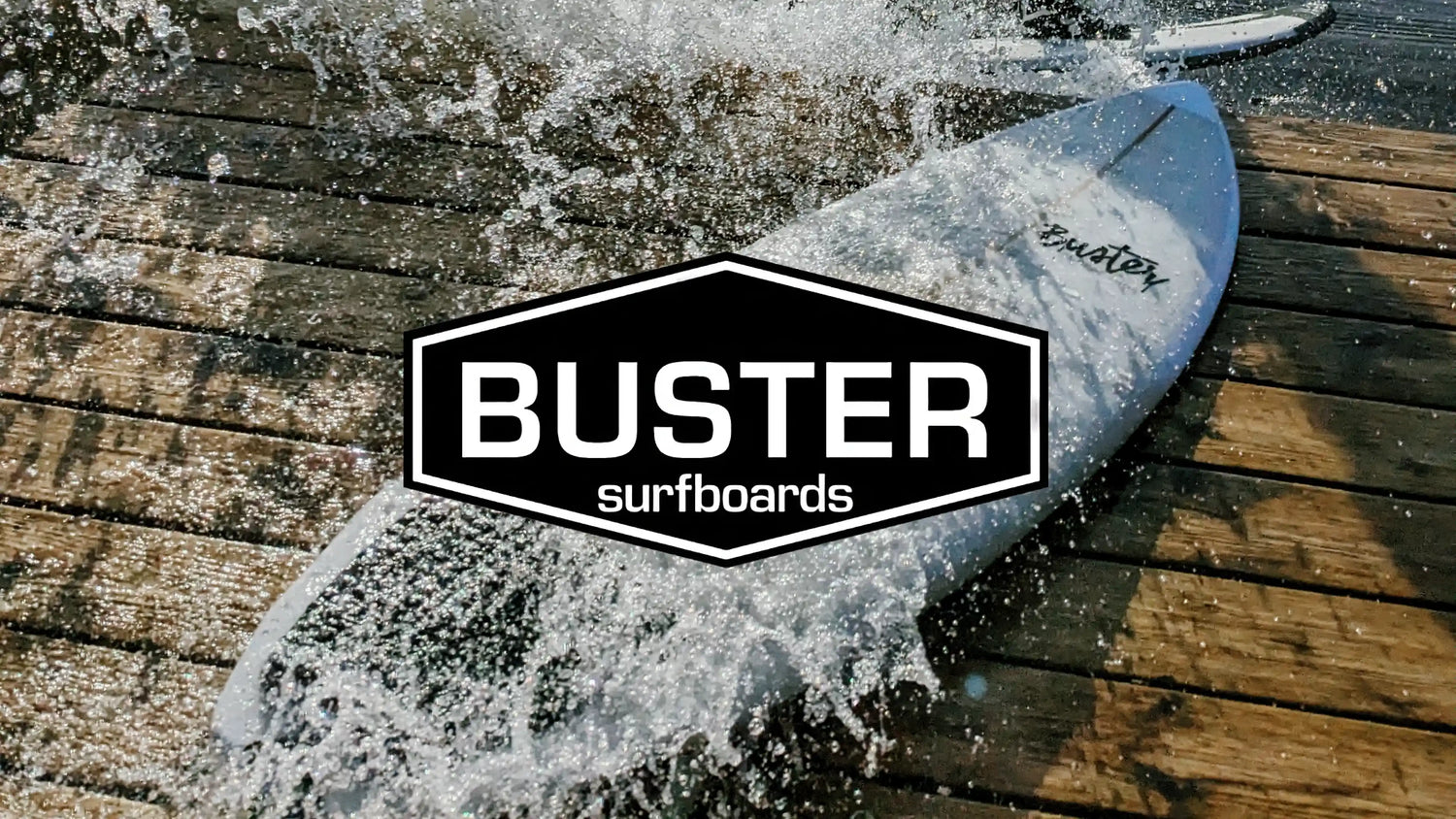 Buster Surfboards surfboard and logo