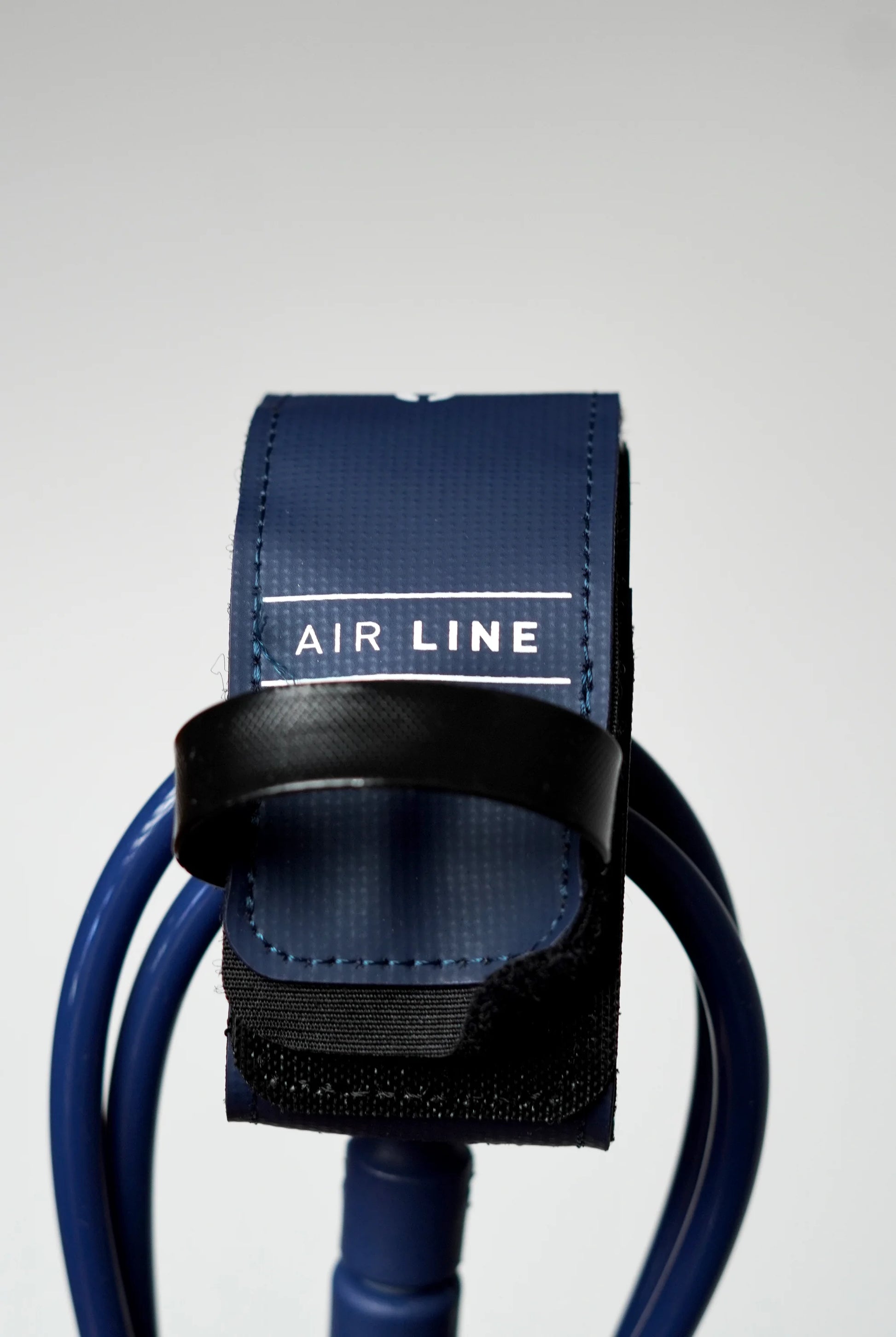 Close-up of the navy Surflogic Air Line leash with closed Velcro